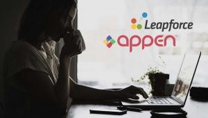 woman sipping tea while looking at her laptop